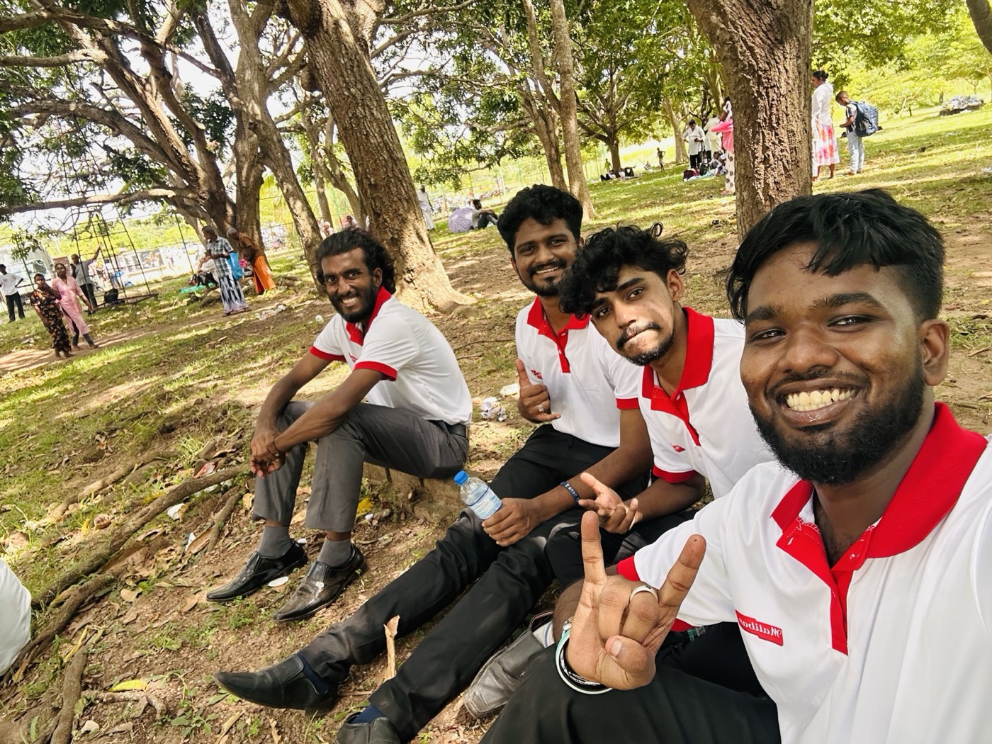 Friends under the trees on campus