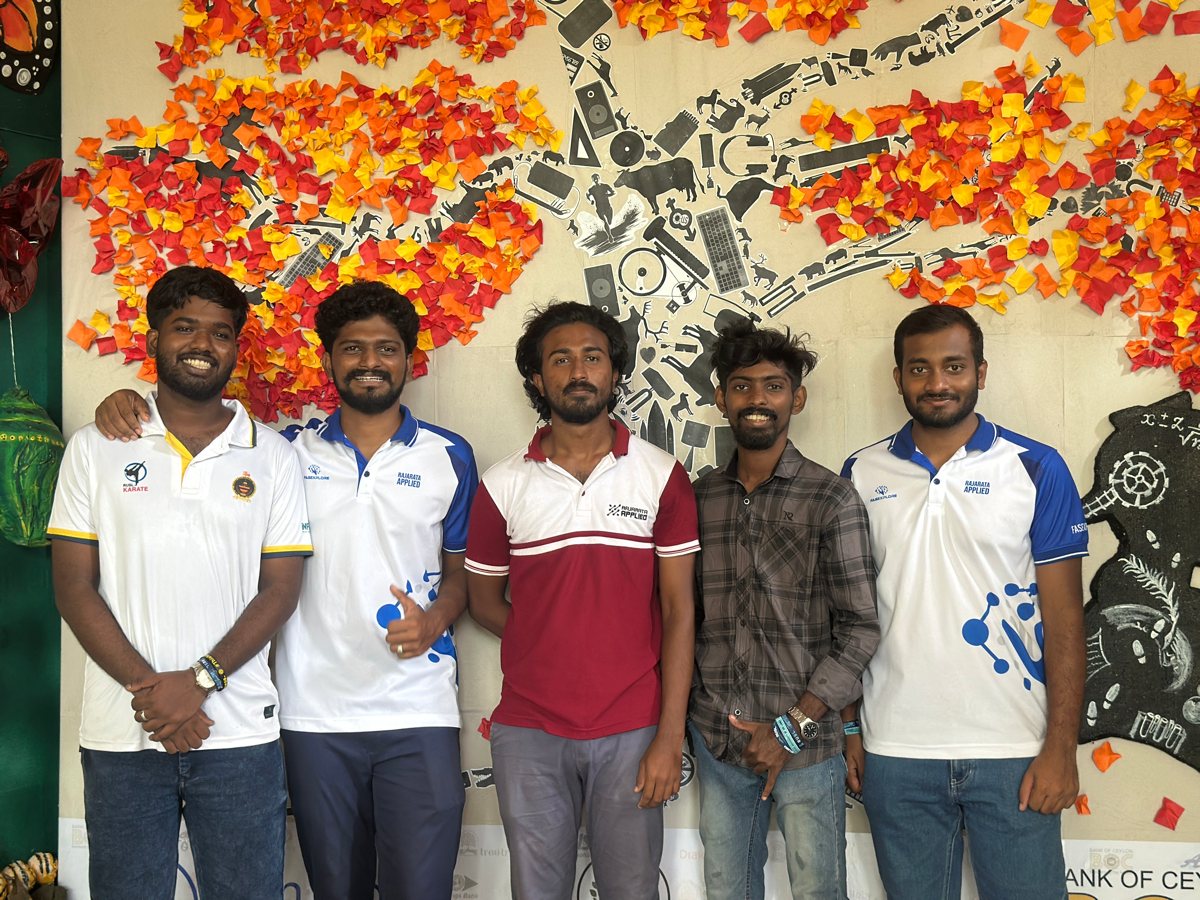 Team photo in front of the mural